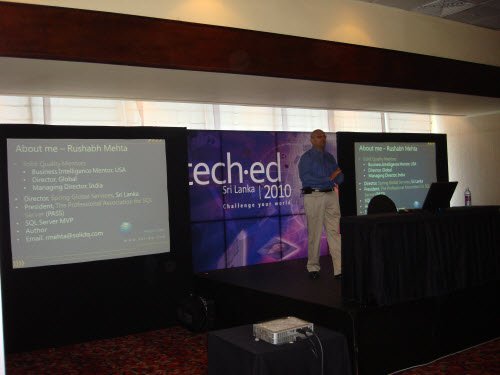 Rushabh Mehta presenting at TechEd Sri Lanka, with an About Me slide on the side screens